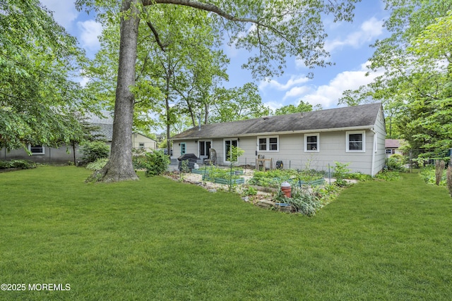 930 Devon St, Forked River, NJ 08731 - back of house with a lawn and a garden