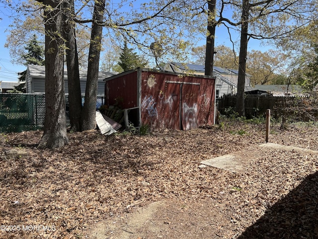 614 Beach Blvd, Forked River, NJ 08731 - view of yard with a storage shed, fence, and an outdoor structure