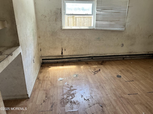 614 Beach Blvd, Forked River, NJ 08731 - spare room featuring hardwood / wood-style flooring and a baseboard heating unit