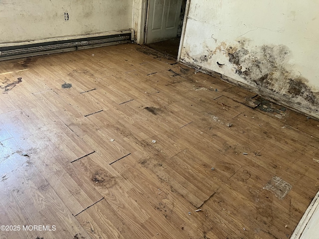 614 Beach Blvd, Forked River, NJ 08731 - detailed view of wood finished floors and a baseboard heating unit