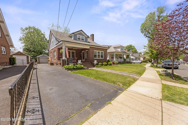 10 Fulton St, Freehold, NJ 07728 - bungalow-style home with covered porch, brick siding, a front yard, an outbuilding, and a chimney