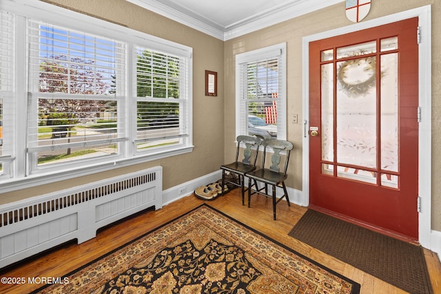 10 Fulton St, Freehold, NJ 07728 - entrance foyer with radiator heating unit, ornamental molding, wood finished floors, and baseboards
