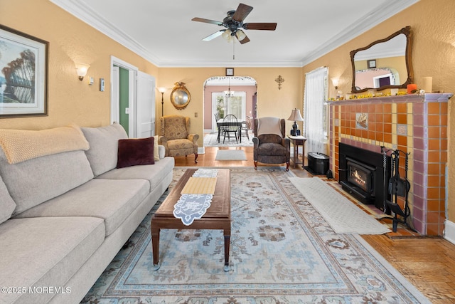 10 Fulton St, Freehold, NJ 07728 - living area featuring wood finished floors, crown molding, ceiling fan, arched walkways, and a textured wall