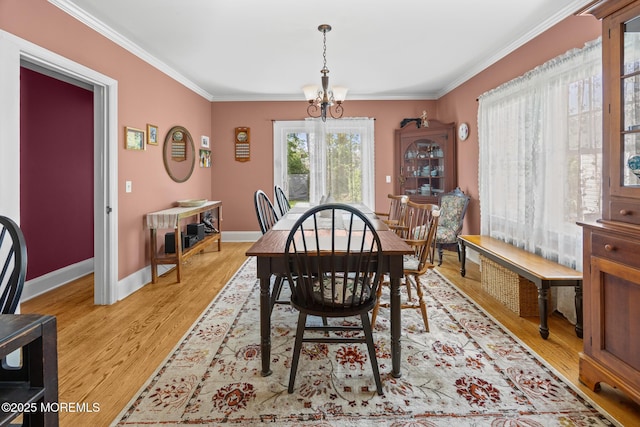 10 Fulton St, Freehold, NJ 07728 - dining space with ornamental molding, a chandelier, light wood-style flooring, and baseboards
