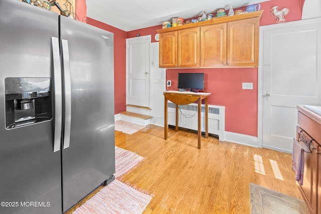 10 Fulton St, Freehold, NJ 07728 - kitchen with stainless steel refrigerator with ice dispenser, light wood finished floors, radiator, baseboards, and a desk
