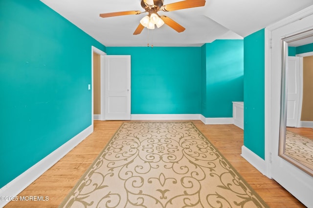 10 Fulton St, Freehold, NJ 07728 - empty room with light wood-type flooring, a ceiling fan, and baseboards