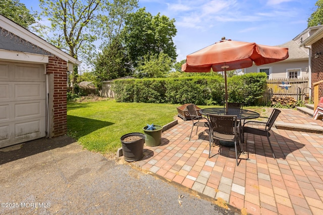 10 Fulton St, Freehold, NJ 07728 - view of patio / terrace featuring outdoor dining area and a garage