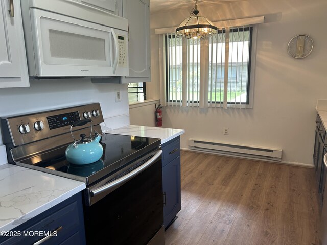 12 Medford Ct, Red Bank, NJ 07701 - kitchen with stainless steel electric stove, white microwave, baseboard heating, blue cabinetry, and a chandelier