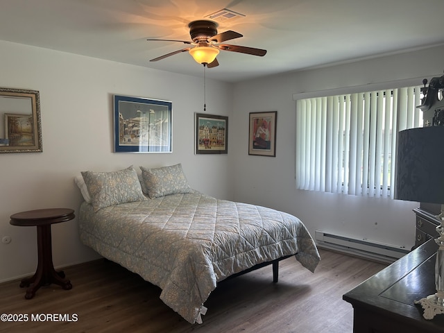 12 Medford Ct, Red Bank, NJ 07701 - bedroom with a baseboard heating unit, wood finished floors, and ceiling fan