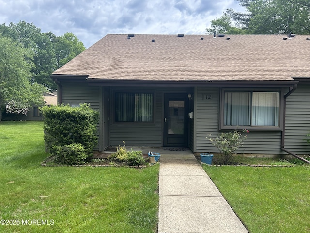 12 Medford Ct, Red Bank, NJ 07701 - view of front of house with a front lawn and roof with shingles