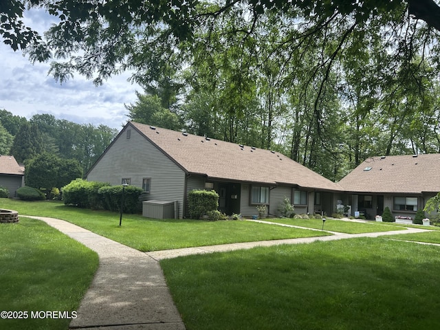 12 Medford Ct, Red Bank, NJ 07701 - view of front of house with a front yard, a shingled roof, and an outdoor fire pit