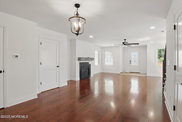 18 Neptune Pl, North Middletown, NJ 07748 - unfurnished living room featuring plenty of natural light, a ceiling fan, wood finished floors, recessed lighting, and a chandelier