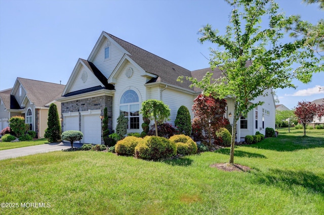 7 Jester Ct, Monroe, NJ 08831 - traditional home with concrete driveway, a front lawn, roof with shingles, and stone siding