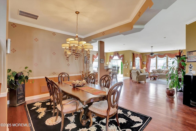 7 Jester Ct, Monroe, NJ 08831 - dining room featuring a chandelier, wood finished floors, ornamental molding, and baseboards
