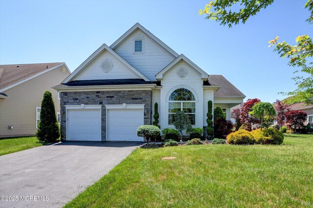 7 Jester Ct, Monroe, NJ 08831 - traditional home featuring a front yard, driveway, a garage, and stone siding