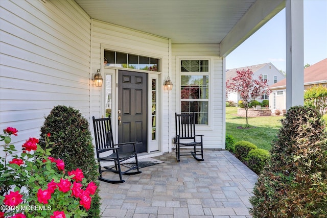 7 Jester Ct, Monroe, NJ 08831 - doorway to property featuring covered porch and a lawn