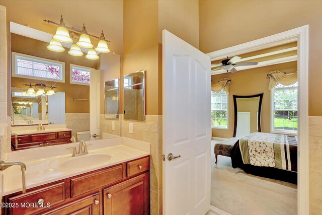7 Jester Ct, Monroe, NJ 08831 - bathroom with tile walls, ensuite bath, a ceiling fan, a wainscoted wall, and vanity