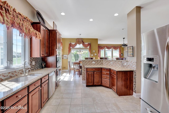 7 Jester Ct, Monroe, NJ 08831 - kitchen featuring appliances with stainless steel finishes, a sink, decorative backsplash, light stone counters, and recessed lighting