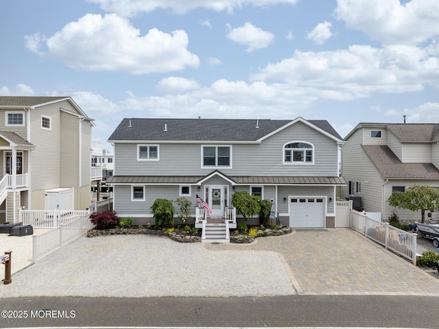 1498 Paul Blvd, Manahawkin, NJ 08050 - view of front facade featuring a standing seam roof, decorative driveway, and metal roof