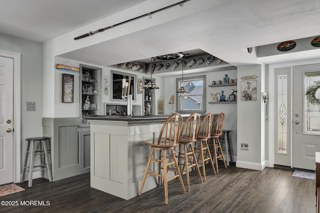 1498 Paul Blvd, Manahawkin, NJ 08050 - indoor wet bar with dark wood-type flooring, plenty of natural light, and baseboards