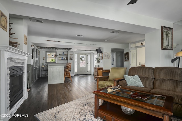 1498 Paul Blvd, Manahawkin, NJ 08050 - living room featuring dark wood-style flooring and a tiled fireplace