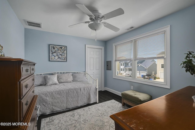 1498 Paul Blvd, Manahawkin, NJ 08050 - bedroom featuring dark wood-style floors, baseboards, a closet, a ceiling fan, and electric panel