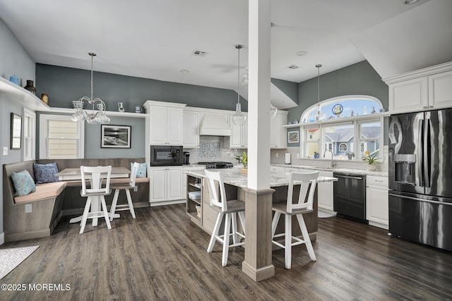 1498 Paul Blvd, Manahawkin, NJ 08050 - kitchen with black appliances, white cabinets, dark wood-type flooring, and a kitchen island
