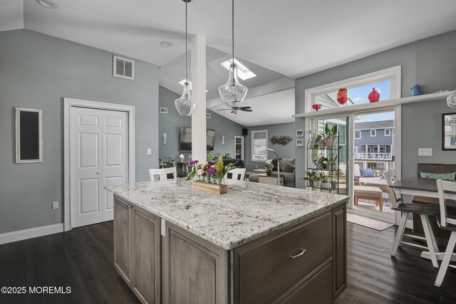 1498 Paul Blvd, Manahawkin, NJ 08050 - kitchen featuring lofted ceiling, ceiling fan, dark wood-style floors, light stone counters, and baseboards