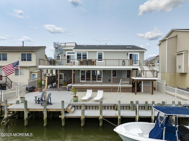 1498 Paul Blvd, Manahawkin, NJ 08050 - back of property with a fenced backyard, stairs, a patio area, and a deck with water view
