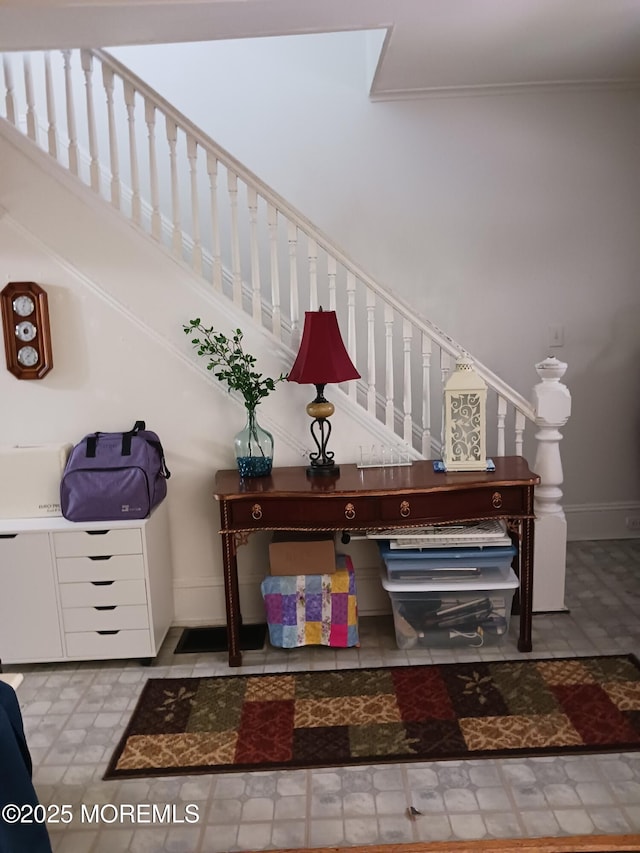 stairs featuring baseboards and tile patterned floors