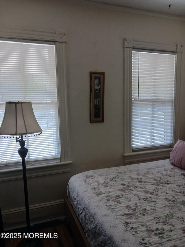 bedroom with ornamental molding