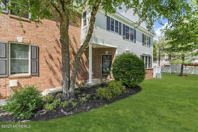 7 Hummingbird Dr, Manalapan, NJ 07726 - view of front facade with central AC unit and brick siding