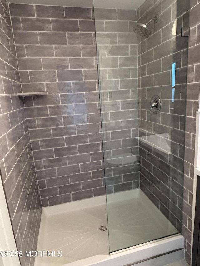 28 Riverside Ave Unit 9G, Red Bank, NJ 07701 - bathroom featuring a tile shower