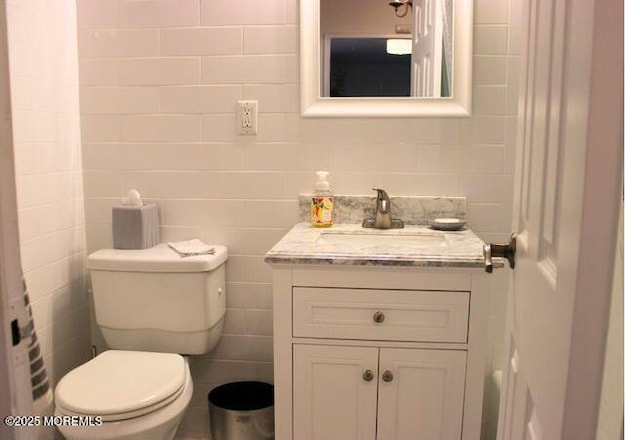 28 Riverside Ave Unit 9G, Red Bank, NJ 07701 - bathroom with vanity, toilet, and tile walls