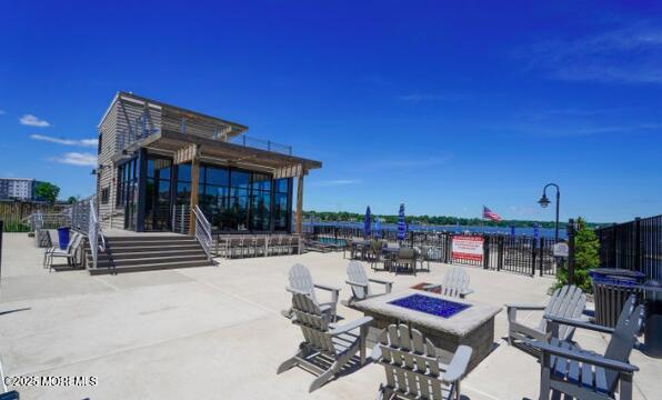 28 Riverside Ave Unit 9G, Red Bank, NJ 07701 - view of patio / terrace with an outdoor fire pit