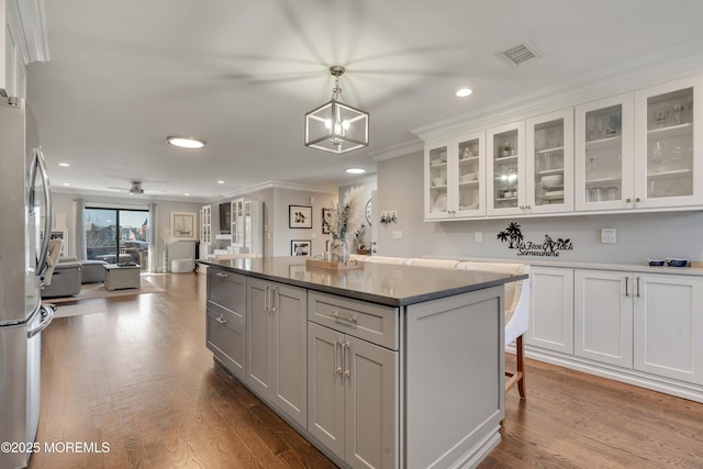 14 Sea Point Dr, Point Pleasant, NJ 08742 - kitchen featuring freestanding refrigerator, recessed lighting, open floor plan, crown molding, and a kitchen island