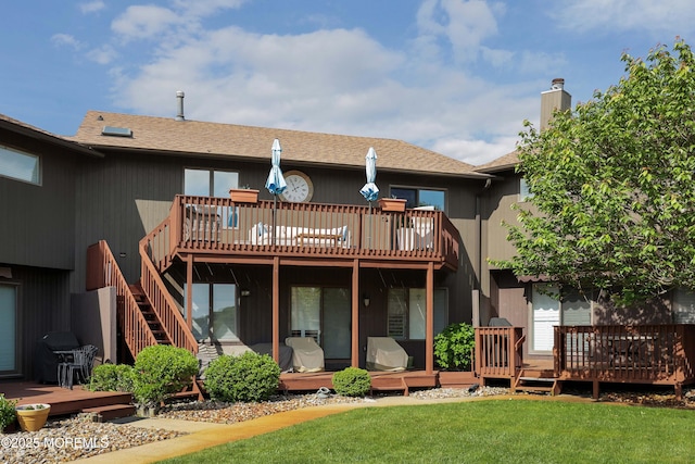 14 Sea Point Dr, Point Pleasant, NJ 08742 - back of property with a deck, a chimney, and a lawn