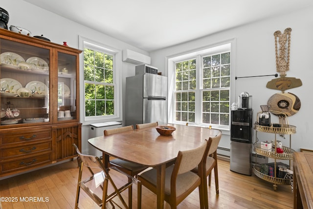 341 Chapel Hill Rd, Atlantic Highlands, NJ 07716 - dining room with light wood-style floors, healthy amount of natural light, and a baseboard heating unit