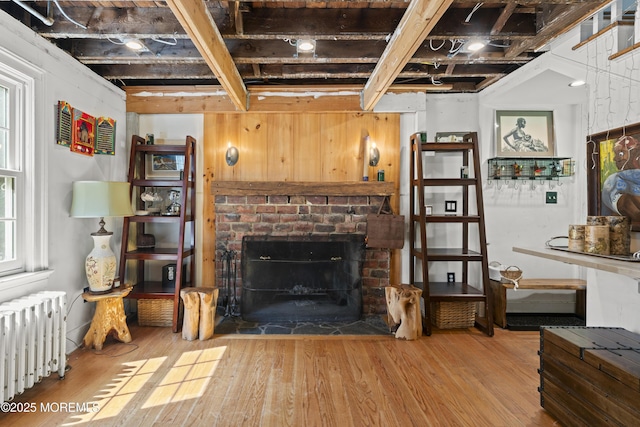 341 Chapel Hill Rd, Atlantic Highlands, NJ 07716 - living area featuring radiator heating unit, wood finished floors, and a brick fireplace