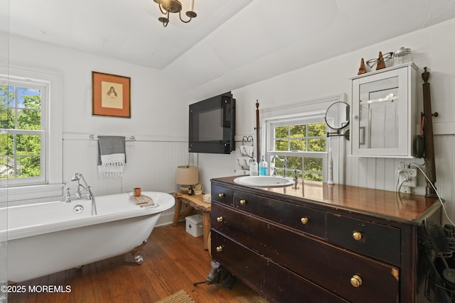 341 Chapel Hill Rd, Atlantic Highlands, NJ 07716 - bathroom with a freestanding tub, vanity, wood finished floors, wainscoting, and vaulted ceiling