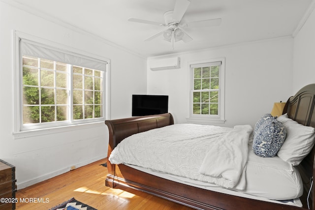 341 Chapel Hill Rd, Atlantic Highlands, NJ 07716 - bedroom featuring a wall unit AC, crown molding, wood finished floors, baseboards, and ceiling fan