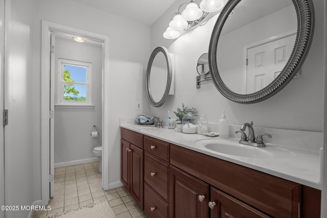 33 Red Maple Dr, Brick, NJ 08724 - bathroom featuring toilet, double vanity, baseboards, and tile patterned floors