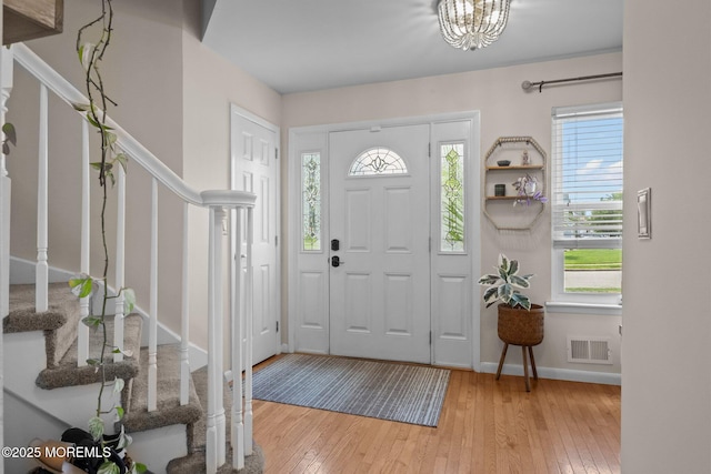 33 Red Maple Dr, Brick, NJ 08724 - foyer entrance featuring stairs, hardwood / wood-style flooring, baseboards, and a chandelier
