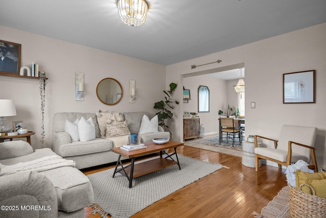 33 Red Maple Dr, Brick, NJ 08724 - living room with light wood-style floors, baseboards, and a chandelier