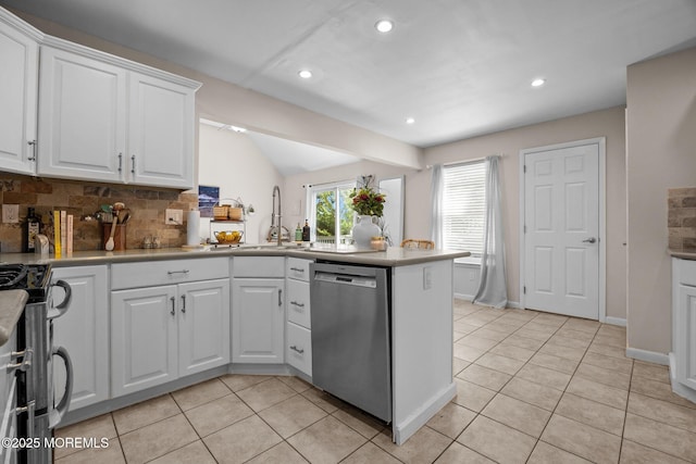 33 Red Maple Dr, Brick, NJ 08724 - kitchen featuring appliances with stainless steel finishes, a sink, a peninsula, light tile patterned floors, and decorative backsplash