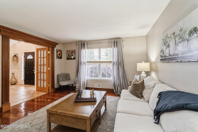 81 W Shenendoah Rd, Howell, NJ 07731 - living area featuring wood finished floors, french doors, and a textured ceiling