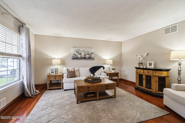 81 W Shenendoah Rd, Howell, NJ 07731 - living room featuring light wood finished floors, a textured ceiling, and baseboards