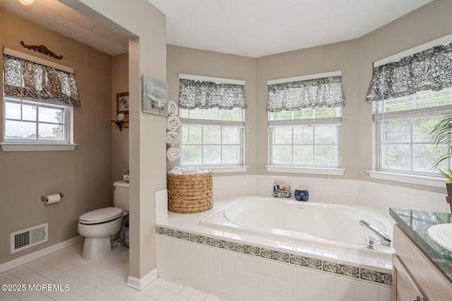 81 W Shenendoah Rd, Howell, NJ 07731 - bathroom featuring a garden tub, plenty of natural light, toilet, and vanity