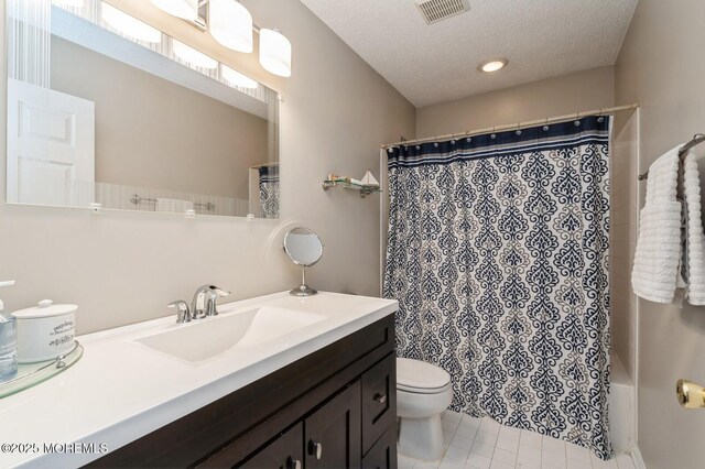 81 W Shenendoah Rd, Howell, NJ 07731 - bathroom featuring vanity, toilet, a textured ceiling, tile patterned flooring, and shower / bath combo