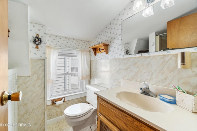 2203 Grand Central Ave Unit B, Lavallette, NJ 08735 - bathroom with wallpapered walls, vanity, toilet, and vaulted ceiling